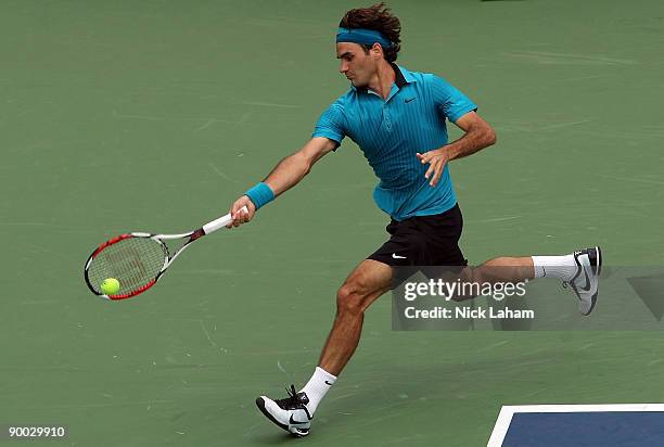 Roger Federer of Switzerland hits a forehand against Novak Djokovic of Serbia in the Singles Final during day seven of the Western & Southern...