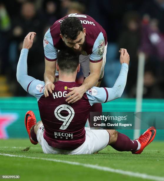 Scott Hogan of Aston Villa celebrates with Robert Snodgrass after scoring their first goal during the Sky Bet Championship match between Aston Villa...