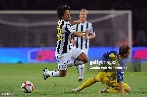 Ribas Da Cunha Diego of Juventus battles for the ball with Michele Marcolini of Chievo during the Serie A match between Juventus FC vs AC Chievo...