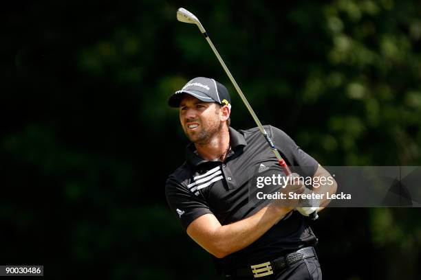 Sergio Garcia of Spain watches his tee shot on the 7th hole during the final round of the Wyndham Championship at Sedgefield Country Club on August...