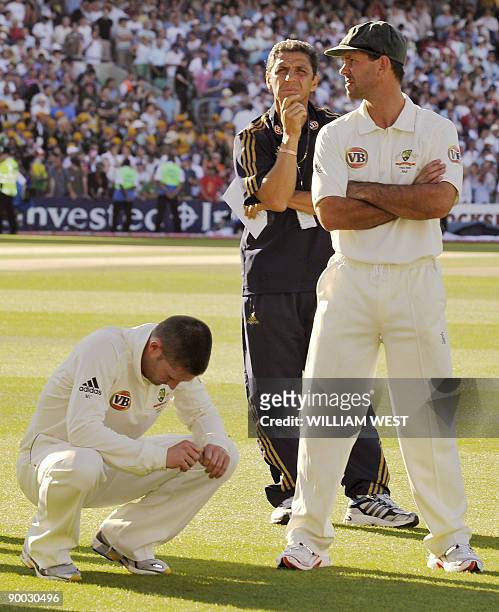Australian players Ricky Ponting and Michael Clarke reflects as England defeats Australia on the fourth day of the fifth and final Ashes cricket Test...