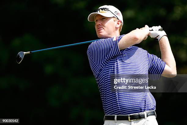Chris Riley watches his tee shot during the final round of the Wyndham Championship at Sedgefield Country Club on August 23, 2009 in Greensboro,...