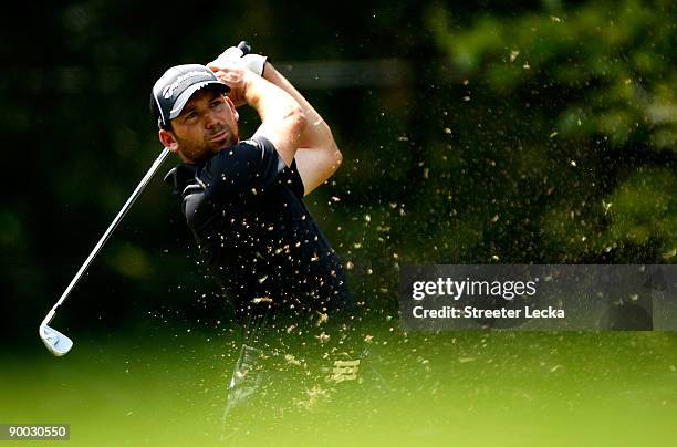 Sergio Garcia of Spain watches a tee shot during the final round of the Wyndham Championship at Sedgefield Country Club on August 23, 2009 in...