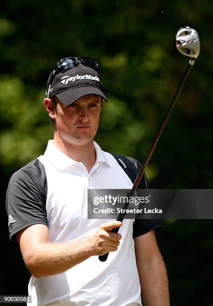 Justin Rose of England lines up his tee shot on the 2nd hole during the final round of the Wyndham Championship at Sedgefield Country Club on August...