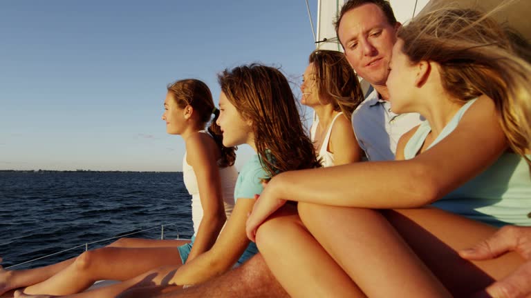 https://media.gettyimages.com/id/900306666/video/parents-and-young-caucasian-sisters-sailing-ocean-yacht.jpg?b=1&s=640x640&k=20&c=Dm47VDANCRtd6v9ii5PHLoFZU0m-OqOd_Sw3X7iOM1M=