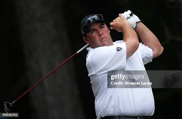 Kevin Stadler watches a his tee shot on the 2nd hole during the final round of the Wyndham Championship at Sedgefield Country Club on August 23, 2009...