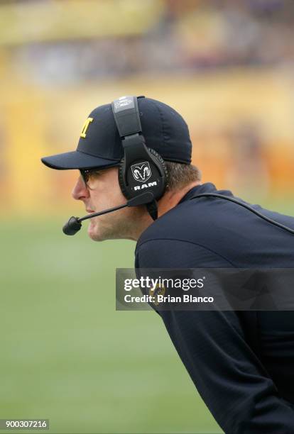 Head coach Jim Harbaugh of the Michigan Wolverines looks on from the sidelines during the second quarter of the Outback Bowl NCAA college football...