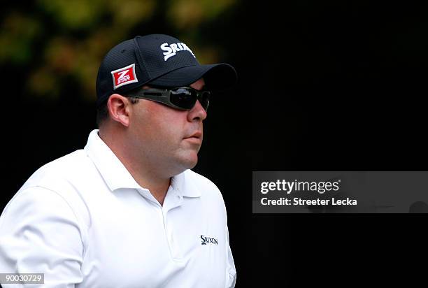 Kevin Stadler walks off the tee box on the 2nd hole during the final round of the Wyndham Championship at Sedgefield Country Club on August 23, 2009...