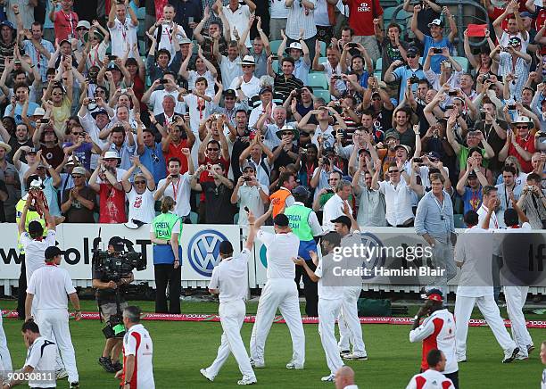 The England team celebrate with the crowd after day four of the npower 5th Ashes Test Match between England and Australia at The Brit Oval on August...