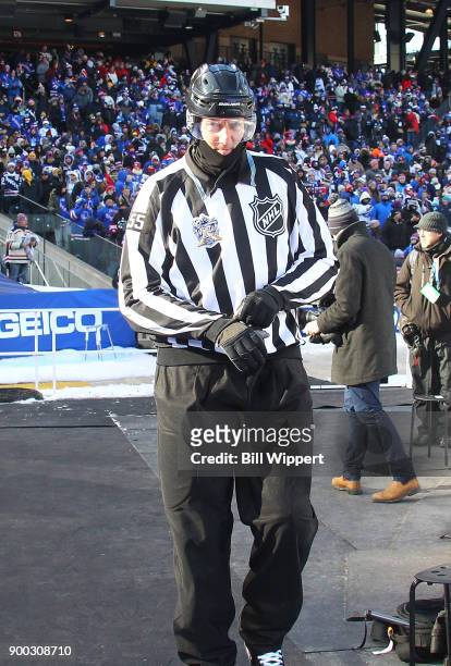 Linesman Shane Heyer heads to the ice for the the 2018 Bridgestone NHL Winter Classic at Citi Field featuring the Buffalo Sabres and New York Rangers...