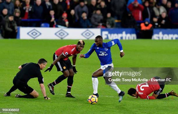 Yannick Bolasie of Everton on the ball as referee Andre Marriner takes a tumble during the Premier League match between Everton and Manchester United...