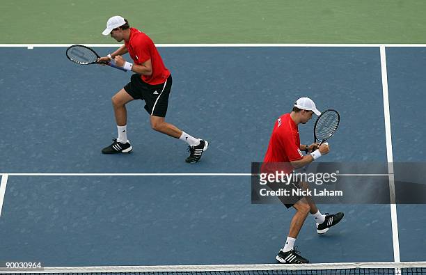 Bob Bryan and Mike Bryan celebrate a point against Nenad Zimonjic of Serbia and Daniel Nestor of Canada in the Doubles Final during day seven of the...