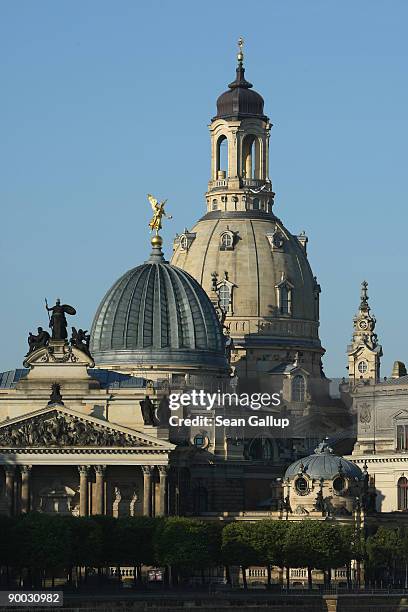 The Frauenkirche cathedral looms over the Akademie der Kuenste August 23, 2009 in Dresden, Germany. Dresden is becoming an increasingly popular...