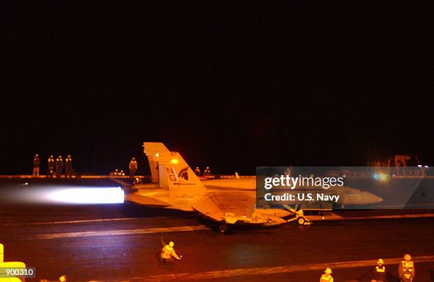 Hornet from the Argonauts of Strike Fighter Squadron One Four Seven prepares for launch December 18, 2001 off the flight deck of USS John C. Stennis....