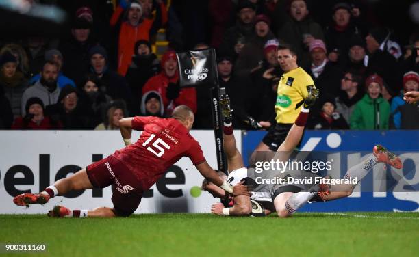 Belfast , United Kingdom - 1 January 2018; Craig Gilroy of Ulster scores his side's second try despite the attenton of Simon Zebo of Munster during...