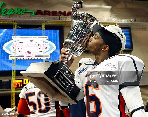 Stanley Franks of the Spokane Shock kisses the trophy after the Shock defeated the Wilkes-Barre/Scranton Pioneers 74-27 in the AFL2 ArenaCup 10 at...