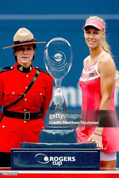 Elena Dementieva of Russia poses for photographers after defeating Maria Sharapova of Russia during the final of the Rogers Cup at the Rexall Center...