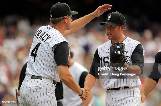 Manager Jim Tracy welcomed relief pitcher Huston Street of the Colorado Rockies off the field after defeating the San Francisco Giants at Coors Field...