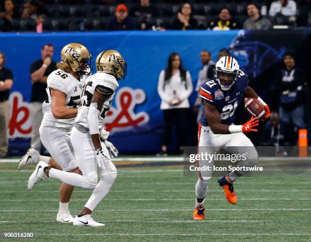 Auburn Tigers running back Kerryon Johnson eludes the Knights defense during the Chick-fil-A Peach Bowl between the UCF Knights and the Auburn War...