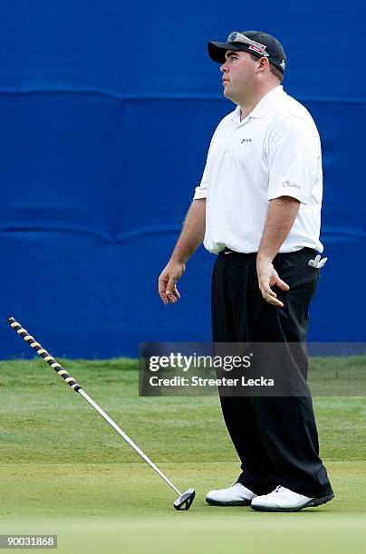 Kevin Stadler reacts to missing a putt on the 18th hole during the final round of the Wyndham Championship at Sedgefield Country Club on August 23,...