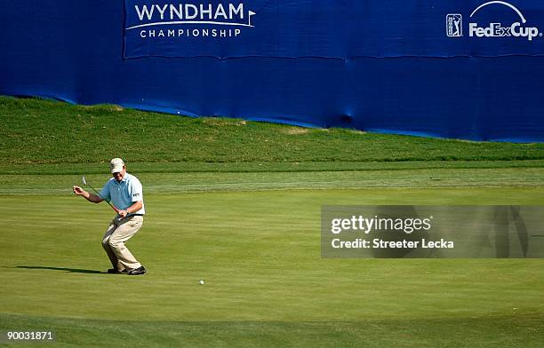 Jason Bohn reacts to missing a putt on the 16th hole during the final round of the Wyndham Championship at Sedgefield Country Club on August 23, 2009...