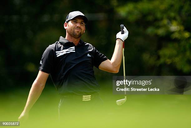 Sergio Garcia of Spain reacts to a tee shot during the final round of the Wyndham Championship at Sedgefield Country Club on August 23, 2009 in...