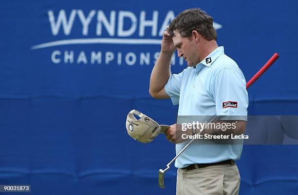 Jason Bohn reacts to missing a putt on the 18th hole during the final round of the Wyndham Championship at Sedgefield Country Club on August 23, 2009...