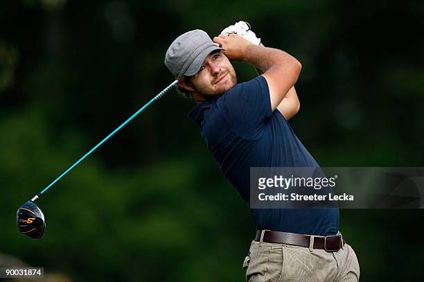Ryan Moore watches his tee shot on the 18th hole during the final round of the Wyndham Championship at Sedgefield Country Club on August 23, 2009 in...
