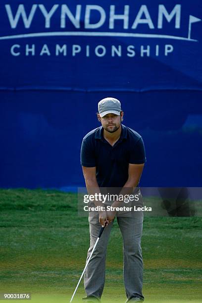 Ryan Moore lines up a putt on the 17th hole during the final round of the Wyndham Championship at Sedgefield Country Club on August 23, 2009 in...
