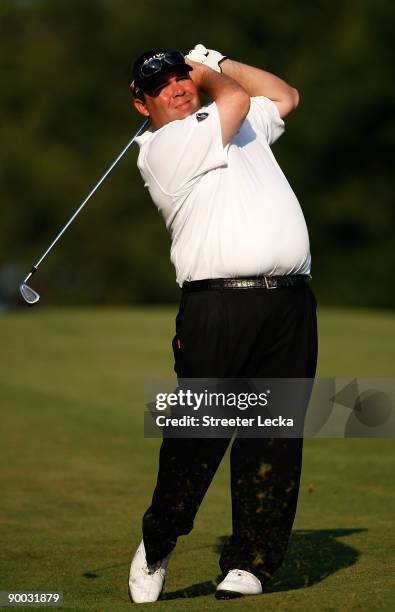 Kevin Stadler watches his shot from the fairway on the 18th hole during the final round of the Wyndham Championship at Sedgefield Country Club on...