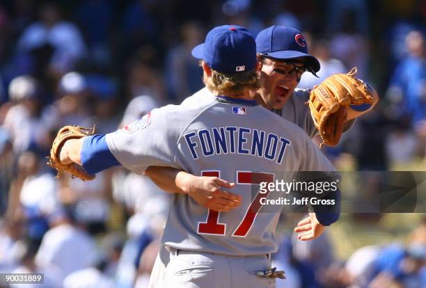 Mike Fontenot and Ryan Theriot of the Chicago Cubs congratulate one another following the Cubs' 3-1 victory over the Los Angeles Dodgers at Dodger...
