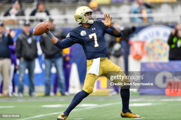 Notre Dame Fighting Irish quarterback Brandon Wimbush throws a deep pass during the first half of the Citrus Bowl game between the Notre Dame...