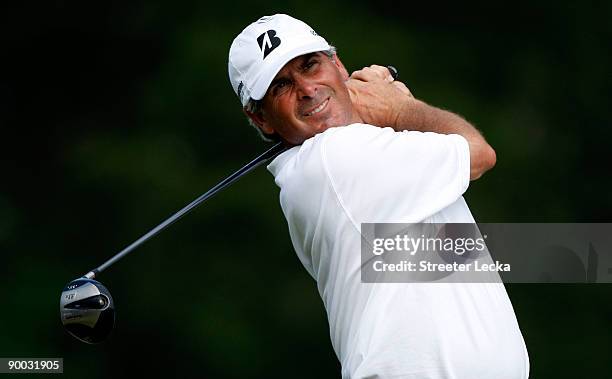 Fred Couples watches his tee shot on the 18th hole during the final round of the Wyndham Championship at Sedgefield Country Club on August 23, 2009...