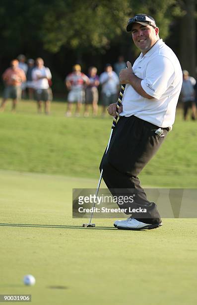 Kevin Stadler reacts to missing a putt on the 18th hole during a sudden death playoff in the final round of the Wyndham Championship at Sedgefield...