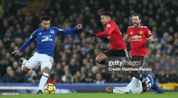 Jesse Lingard of Manchester United in action with Mason Holgate of Everton during the Premier League match between Everton and Manchester United at...