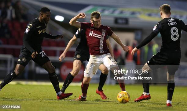 Chris Long of Northampton Town attempts to control the ball during the Sky Bet League One match between Northampton Town and Wigan Athletic at...