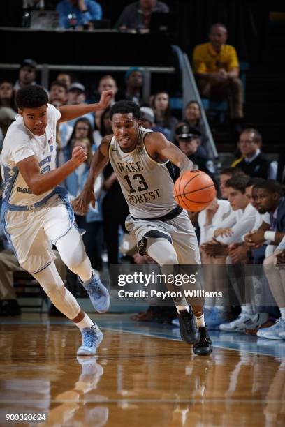 Bryant Crawford of the Wake Forest Demon Deacons dribbles the ball against the North Carolina Tar Heels on December 30, 2017 at the Dean Smith Center...