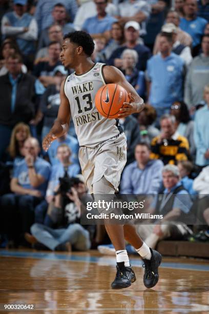 Bryant Crawford of the Wake Forest Demon Deacons dribbles the ball against the North Carolina Tar Heels on December 30, 2017 at the Dean Smith Center...