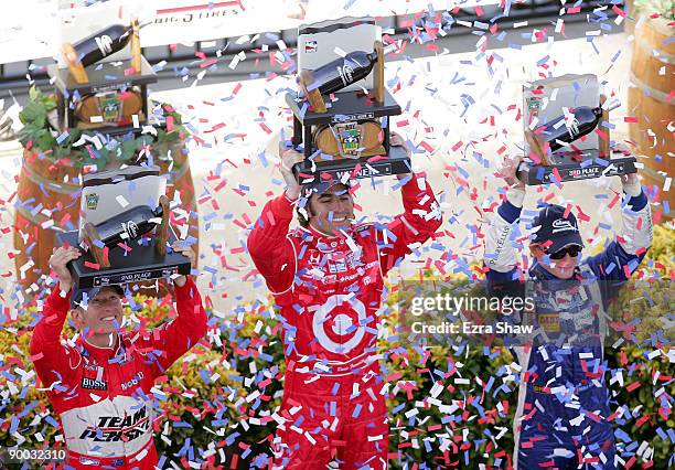 Winner, Dario Franchitti driver of the Target Chip Ganassi Racing Dallara Honda, Ryan Briscoe driver of the Team Penske Dallara Honda and Mike Conway...