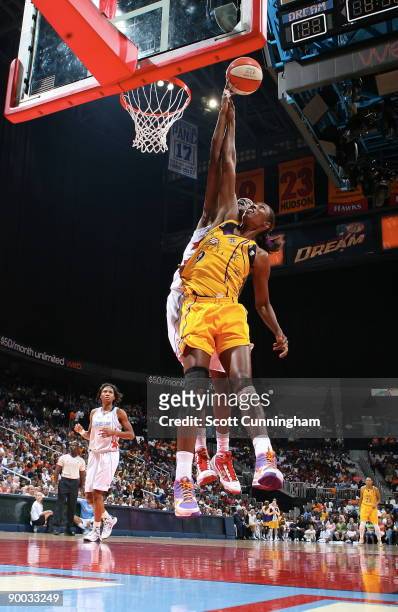 Lisa Leslie of the Los Angeles Sparks goes up for a rebound against Michelle Snow of the Atlanta Dream at Philips Arena on August 23, 2009 in...