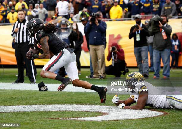 Defensive back JaMarcus King of the South Carolina Gamecocks intercepts a pass in the end zone intended for wide receiver Donovan Peoples-Jones of...