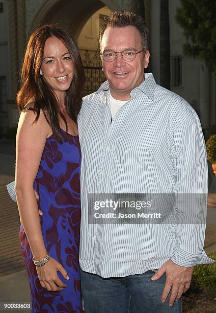 Actor Tom Arnold and Ashley Groussman arrive at the season two premiere of the FX television series "Sons of Anarchy" at the Paramount theatre on...