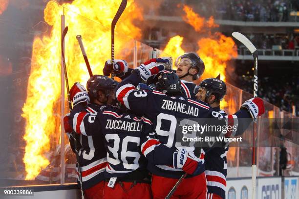 Miller of the New York Rangers celebrates his game-winning overtime goal against the Buffalo Sabres during the 2018 Bridgestone NHL Winter Classic at...