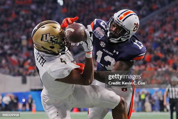 Tre'Quan Smith of the UCF Knights is unable to make a reception against Javaris Davis of the Auburn Tigers in the second half during the Chick-fil-A...