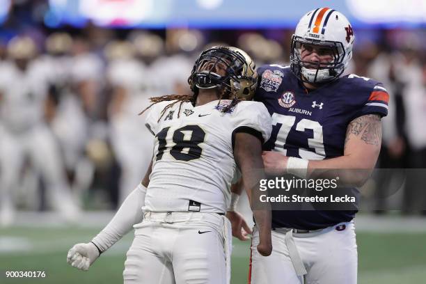 Shaquem Griffin of the UCF Knights celebrates after sacking Jarrett Stidham of the Auburn Tigers in the third quarter during the Chick-fil-A Peach...