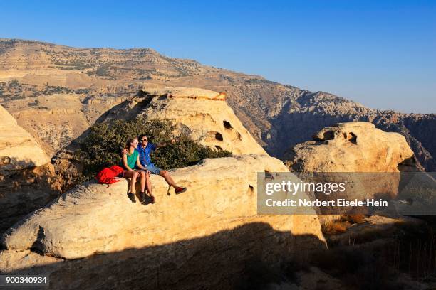 hikers at white domes trail, dana biosphere reserve, dana, jordan - bioreserve stock pictures, royalty-free photos & images