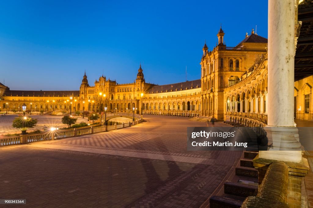 Illuminated Plaza de Espana at dusk, Seville, Andalusia, Spain
