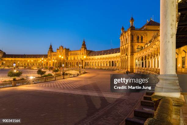 illuminated plaza de espana at dusk, seville, andalusia, spain - provincia de sevilla stock pictures, royalty-free photos & images