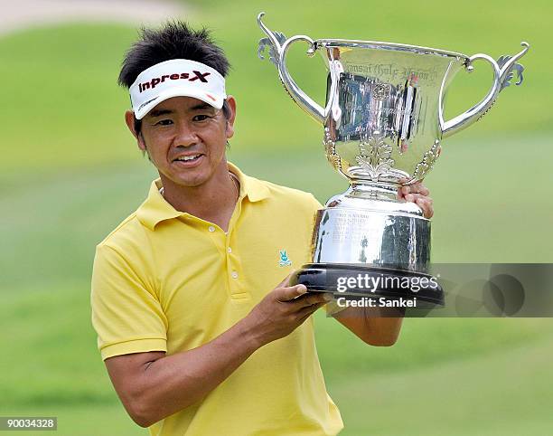 Hiroyuki Fujita holds the trophy after winning Kansai Open Golf Championship 2009 at Takarazuka Golf Club on August 23, 2009 in Takarazuka, Hyogo,...