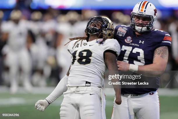 Shaquem Griffin of the UCF Knights celebrates after sacking Jarrett Stidham of the Auburn Tigers in the third quarter during the Chick-fil-A Peach...